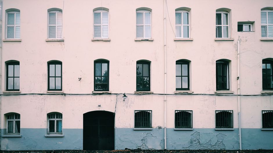 Row of painted house fronts in contrasting colours