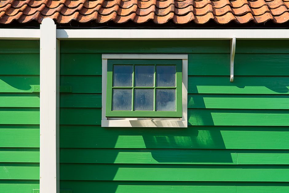 Painted house facade with symmetrical windows
